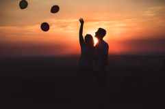 silhouette photo of couple standing outdoors